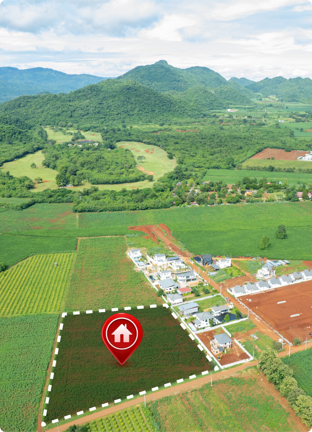Plot of land with house icon, surrounded by greenery.